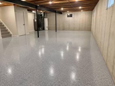 Grey coating carried across a basement slab past the furnace