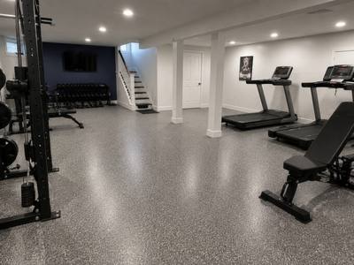 Basement slab coated and set up as a home gym