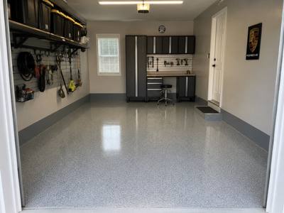 Single bay garage floor coated under fitted wall storage