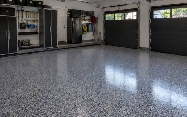 Grey flake garage floor coating finished square to the door track