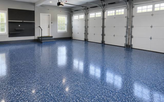 Blue floor holding a wet gloss under a polyaspartic top coat